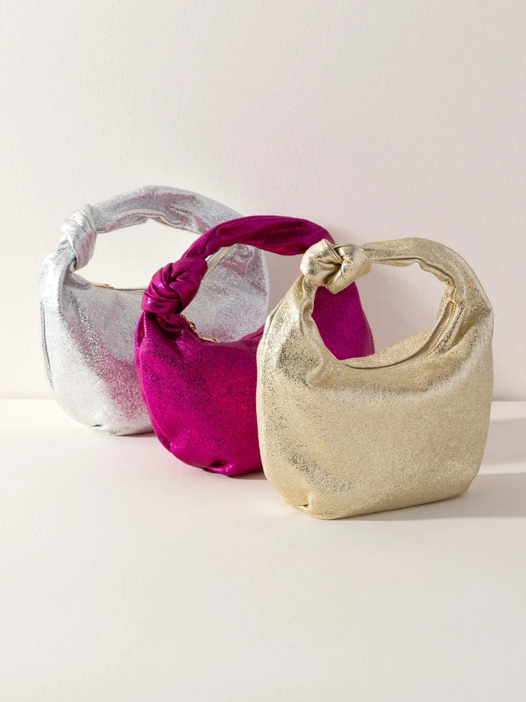 CHRISSY KNOTTED METALLIC TOP HANDLE BAG SHIRALEAH